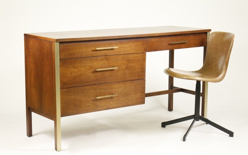 Mid Century Modern Desk Paul McCobb Calvin Group: American, circa 1950s. Mid Century Modern walnut and brass mounted desk in linear form with rectangular top over four long drawers with brass rectangular pulls on square legs the fronts mounted with b