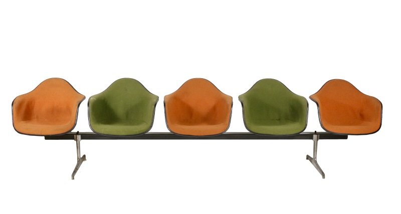 Herman Miller Seating Unit for 5: American, circa 1974. Herman Miller seating unit for waiting room or airport lounge comprised of 5 molded shell seats latex foam rubber alternating in colors of avocado and orange, all outlined in bla