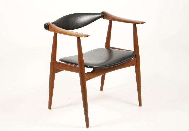 Hans Wegner Carl Hansen CH 34 Arm Chair: Danish, circa 1960's. Hans Wegner (1914 - 2007) CH 34 teak arm chair, stream lined with black leather backsplat and black vinyl seat, on turned tapered legs, manufactured by Carl Hansen. Signed with b