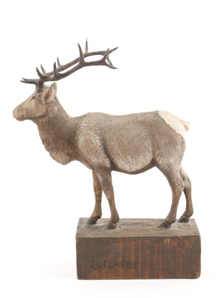 John L. Clarke (Cutopius) Carved Elk Sculpture: John L. Clarke (Cutopius, Man Who Talks Not), (American, 1881-1970), "Elk (Wapiti)", carved wood sculpture, incised signature on integral rectangular base "J.L. CLARKE", opposite side with "CUTOPUIS".