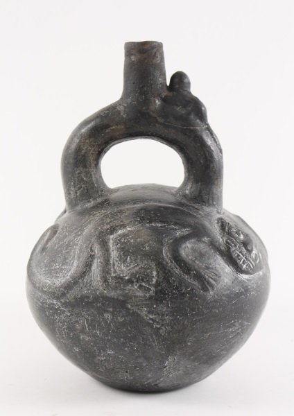 Chimu Blackware Stirrup Vessel w/ Panther & Monkey: Pre-Columbian, Late Chimu culture (1100 AD - 1470 AD) to early Incan Empire (1438-1533). A stirrup spout black-ware pottery vessel, the globular body having decoration in relief on either side of a pa