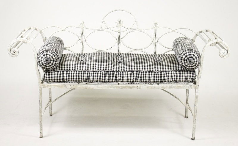 White Painted Iron Bench w/Silk Gingham Pillows: 20th century. Weathered and antiqued white painted wrought iron window bench or sette with scrolled arms and interlacing loop decoration on back with three ball finials at center. Bench with black and