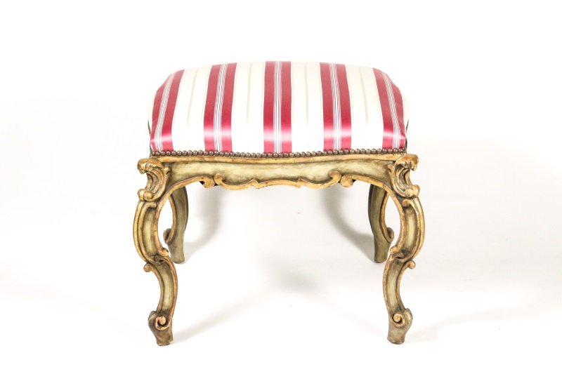 Italian Parcel Gilt & Polychrome Tabouret, 20th C.: Italian, 20th century. Carved wood and gesso tabouret or vanity stool with C scroll decoration throughout in green polychrome with parcel gilt accents. Seat upholstered in pink and white striped fabri