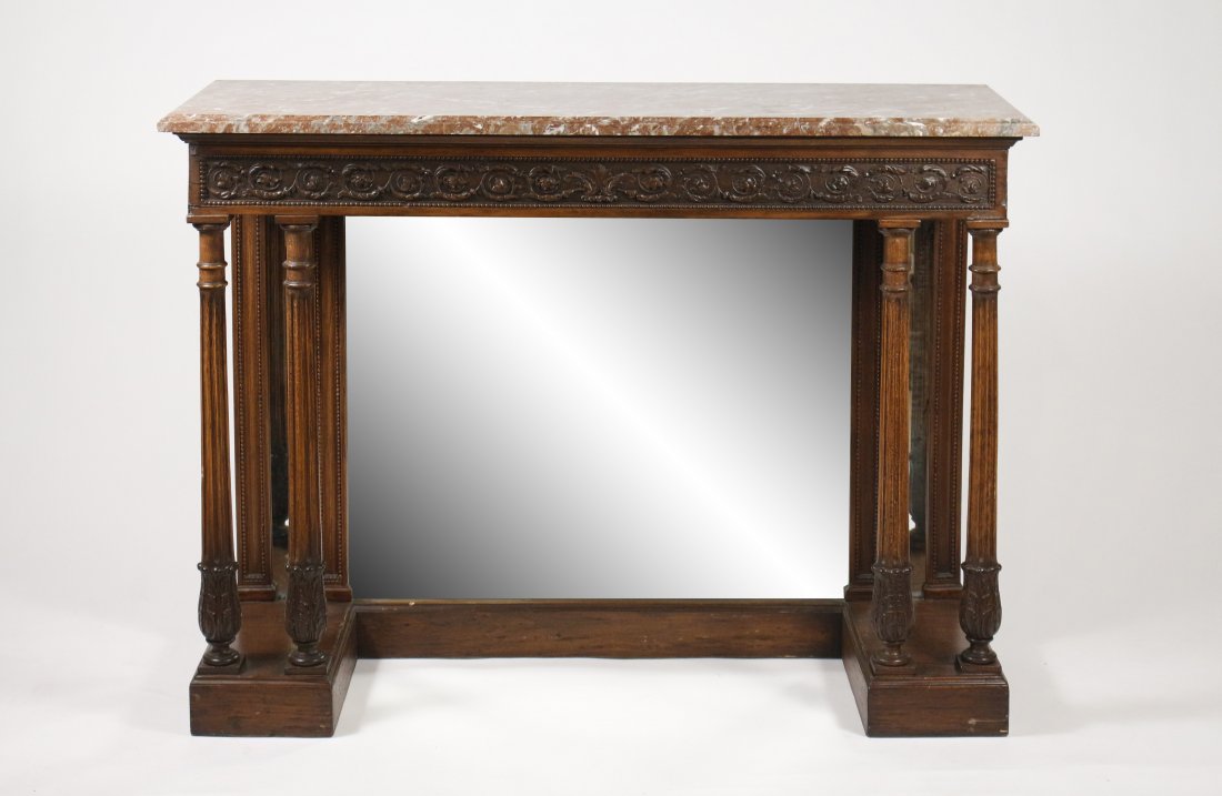 French Marble Top Mirrored Back Console: French, 19th century. French marble top stained oak console table with beaded and rinceau carved frieze with mirror back and twin columnar supports, fluted and foliate wrapped, on rectangular plinth. 