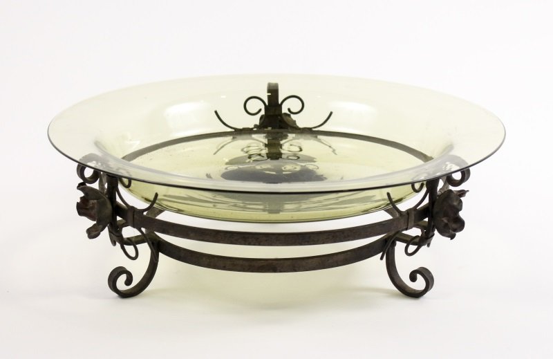 Steuben Glass Centerpiece Bowl on Iron Base: American, first half of 20th century. Steuben art glass console or center bowl of light yellow to green color marked on bottom with stenciled Steuben mark on bottom raised on black iron stand with thr