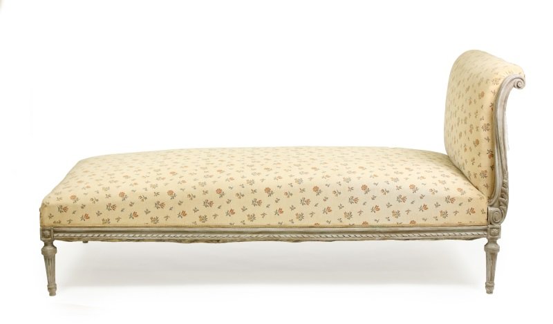 French Louis XVI Style Painted Chaise Lounge: French, Late 19th/early 20th century. Louis XVI style gray painted chaise lounge or day bed with scrolled and padded end rail over a padded seat the whole covered in floral upholstery, the seatrail ca