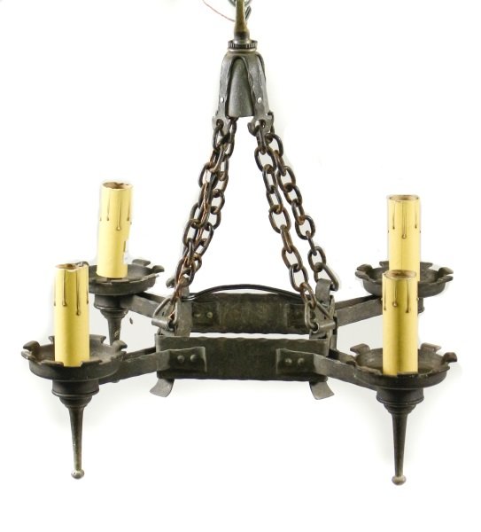 Gothic Style Wrought Iron Four Light Chandelier: 20th century. Gothic style four light hanging chandelier with four electrified lamp sockets within circular candle cups with flared dentilated borders above tapered drop spires with rounded tips, lamp