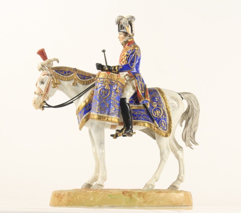 German Porcelain Military Figurine on Horseback: Carl Thieme/ Potschappel (German, f. 1872). A porcelain figural sculpture depicting a Napoleonic French soldier on horseback with ceremonial war drums mounted to either side of saddle, the soldier and