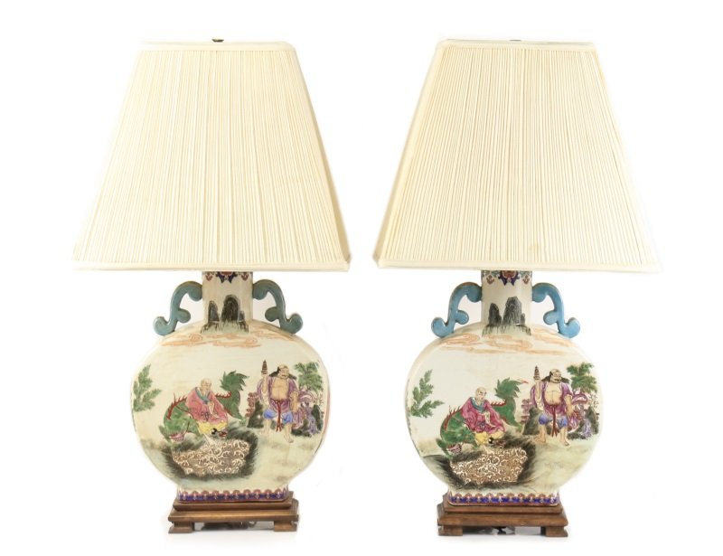 Matched Pair Chinese Porcelain Moon Flask Lamps: Chinese, 20th century. A matched pair of porcelain moon flasks converted to lamps, each having hand embellished transfer decoration to white body on tondo of six Buddhist monks or elders seated in a g