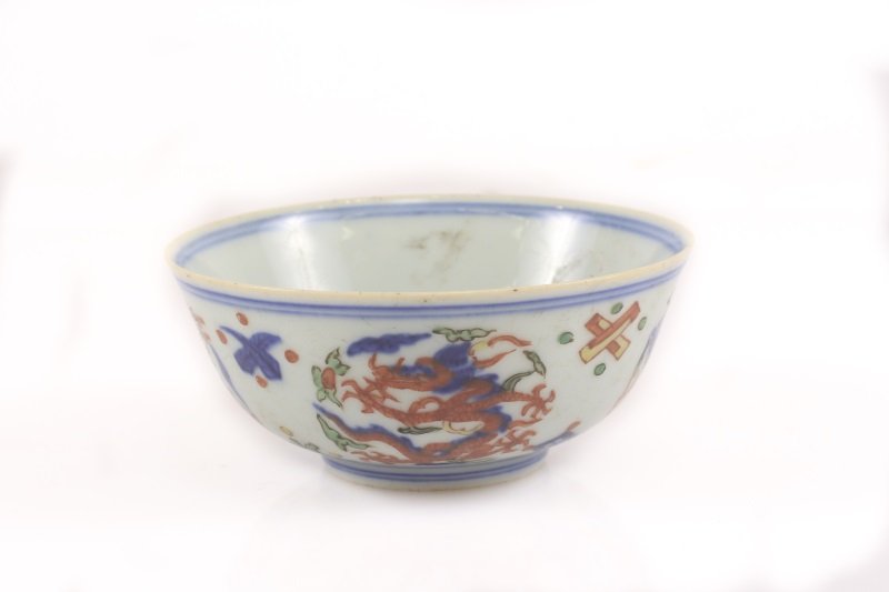 Chinese Wucai 5-Clawed Dragon Bowl, Wanli Mark: Chinese, Ming Dynasty Wanli Period mark (1563-1620), likely 19th century but possibly earlier. A low porcelain bowl having traditional Wucai enamel decoration of cobalt blue underglaze and overglaze h