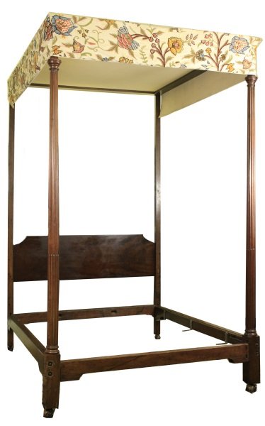 19th Century Walnut Carved Tester Bed: 19th century walnut carved tester bed, the shaped headboard joined by square tapered posts, mortise and tenon construction, the front posts turned and fluted, raised on casters. Height 102.5", width 8