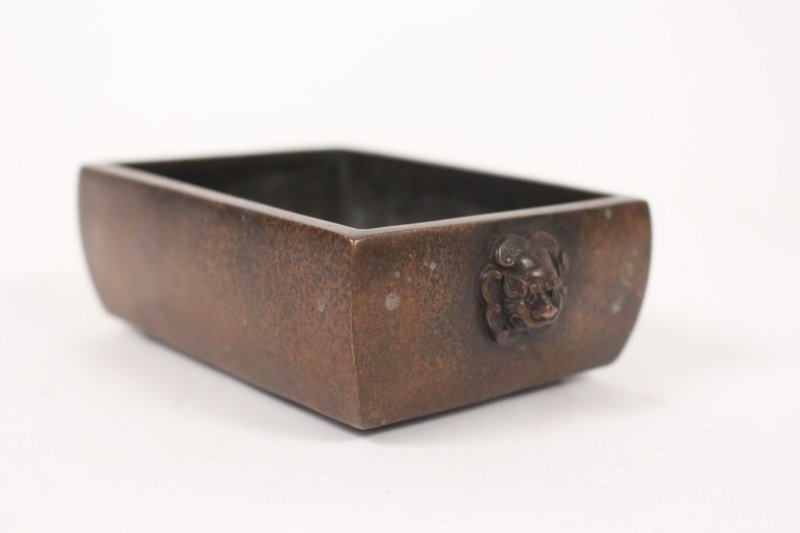 Chinese Copper Censer w/Foo Dog Handles, Marked: Chinese copper incense burner or censor of rectangular form with bowed edges, sides with foo or fu dog head mounts. Underside with impressed archaic seal mark, possibly for Xuande (1426-1435) in the M