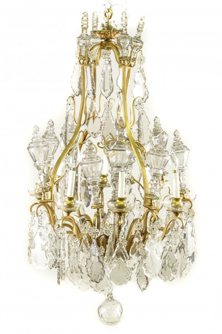 French Gilt Bronze & Crystal 12 Light Chandelier: French Louis XV style gilt bronze and crystal twelve light hanging chandelier light fixture with open cage with acanthus leaf tips on canopy above serpentine form with scrolled arms below electrified 
