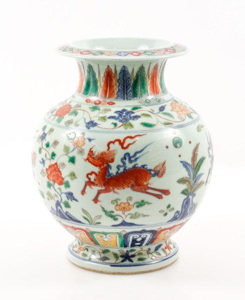 Chinese Doucai Vase with Longma Motif, Xuande Mark: Chinese, Ming Dynasty Xuande Period Mark, likely late 19th/ early 20th century. A white porcelain vase with hand painted Doucai decoration in cobalt, rust, green, and yellow, the vase with narrow roun