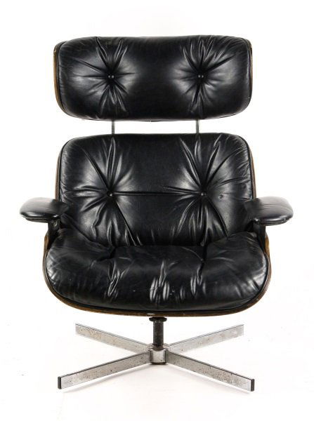Eames Style Wood, Chrome, & Black Leather Armchair: American (Leominster, Massachusetts), Mid 20th century. Frank Doerner for Selig Manufacturing Company, lounge armchair style of Charles and Ray Eames with black leather upholstery with tufted seat, ba