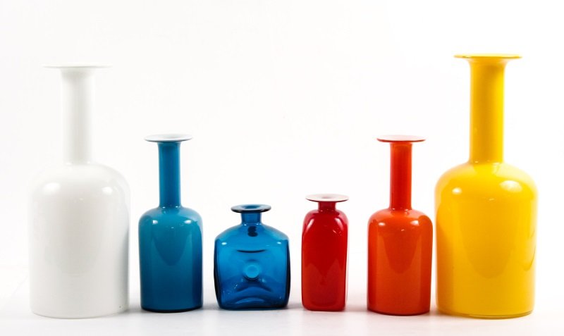 Six 1960s Holmegaard Glass Vases, Otto Brauer: Holmegaard Glass (Danish, founded 1825). A collection of six 1960s Holmegaard Glass vases comprising of four "Gulvvase" vases with one large cased vase with yellow over white, one large opaque white v