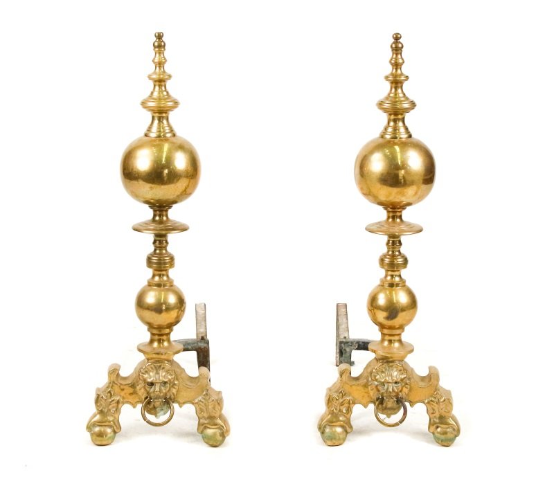 Pair of Bulbous Brass Andirons w/ Lion's Heads: A pair of 19th century brass and iron andirons or firedogs comprising of ring turned finials surmounting bulbous brass balls over ring turnings surmounting smaller brass balls resting on acanthus shap