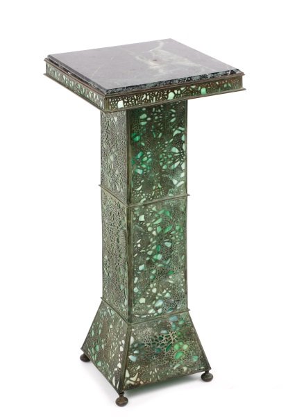 Riviere Studios Grapevine Slag Glass Pedestal: Riviere Studios (American, 1904-1931), early 20th century. An Art Nouveau bronze green slag glass pedestal in the Grapevine pattern, the black marble top with cavetto molded edges over the green slag