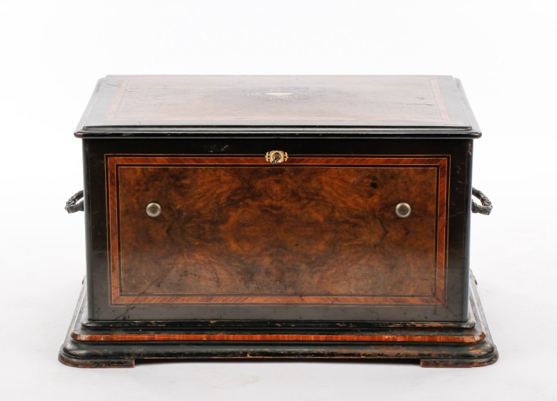 19th C. Swiss Burled Wood Cylinder Music Box: Swiss, late 19th century. A tabletop rectangular eight tune organ box, the case comprising ebonized wood with burled walnut veneer panels trimmed in tulipwood banding, the lid with central mother of p