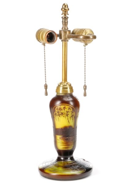 French Cameo Art Glass Lamp, Signed Michel: French, early 20th century. Michel Nancy French cameo art glass bypass table lamp, body with swelled shoulders surmounting a circular base, lime colored glass overlaid in deep amethyst and cut with vi