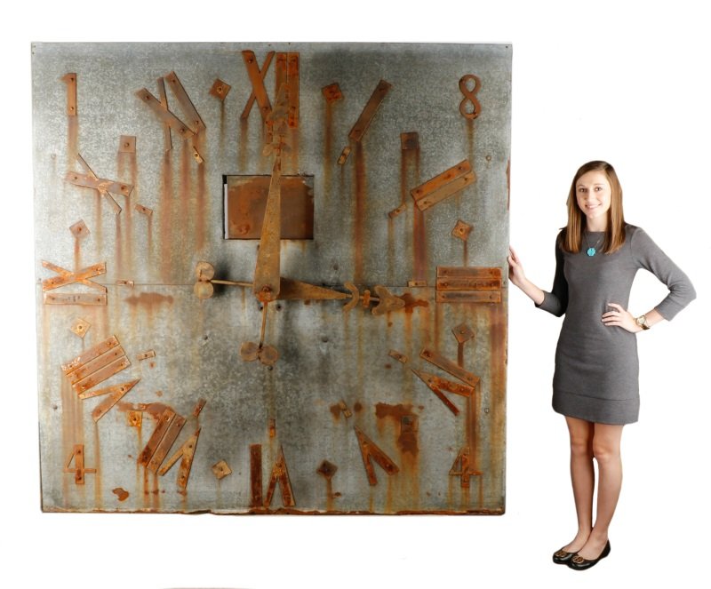 Oversized Galvanized Steel Wall Clock, 20th C.: American, 20th century. An oversized rectangular galvanized steel wall clock with red oxidized Roman numerals and large decorative central dial. Approximate height 73.75", width 73.25", Provenance: Pr