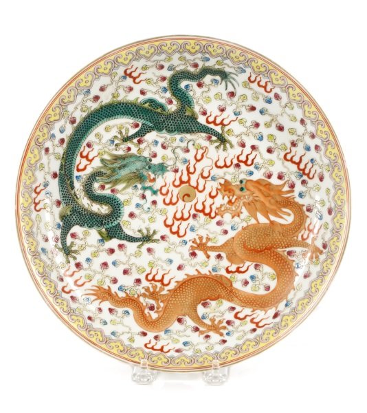 Chinese Chien Lung Style Saucer w/ Dragons, Marked: Chinese, Qing Dynasty (1644-1912) Qianlong Period mark (1736-1795), likely 20th century. A large saucer or shallow bowl decorated to interior with two opposing swirling five-clawed dragons, one green 