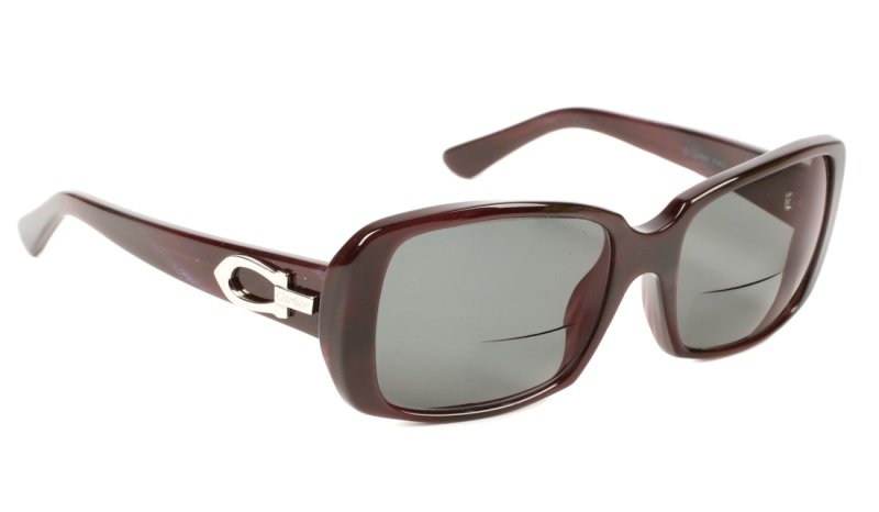 Ladies Cartier Deep Violet to Maroon Sunglasses: Cartier (French, founded 1847). Contemporary women's sunglasses with deep violet purple to maroon red colored frames with shaped square form. Sunglasses currently with bifocal prescription lenses but