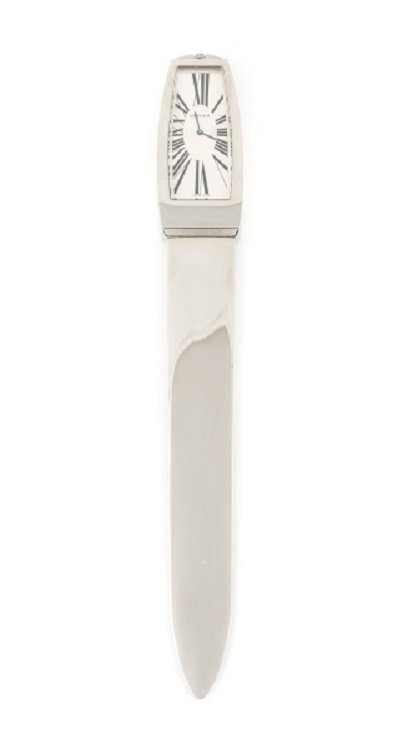 Cartier Platinum Finish Letter Knife w/ Clock, COA: Cartier (French, founded 1847). A serie limitee platinum finish letter opener with clock handle, #1682/2000, the knife of traditional form with wide and smooth blade with functioning clock as handle, 