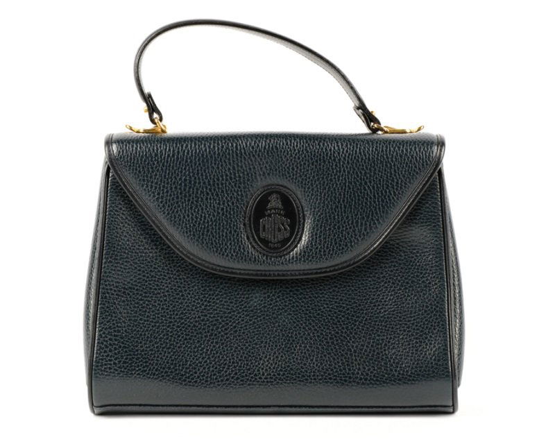 Vintage Mark Cross Navy Leather Handbag: Mark Cross (American (Boston), founded 1845), circa 1980s. A vintage navy blue leather ladies handbag or purse of tapering rectangular form with flap front closure and brass hardware, the accordion in