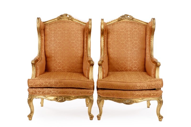 Pair of Louis XV Giltwood Bergeres avec Orielles: French,late 19th/early 20th century. Matched pair of Louis XV style giltwood Bergeres avec Orielles, each with a padded back, sides seat surmounted by a pierced floral crest and within a rope-carved f