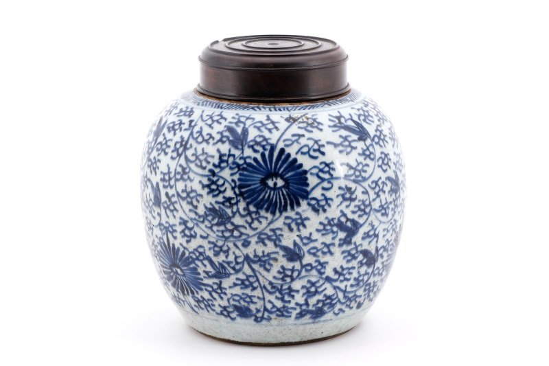Chinese Blue & White Porcelain Ginger Jar: Chinese, likely early 20th century. Porcelain ginger jar of traditional form with rounded body decorated in hand painted blue and white motif with flowers and stylized branches. Jar or vessel with sta