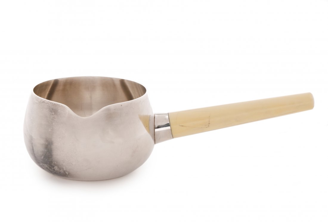 Georg Jensen Sterling Sauce Pot with Bone Handle: Henning Koppel (1918-1981) for Georg Jensen (Danish, founded 1904), circa 1945-1981. A sterling silver sauce pot or creamer of simple round form with everted spout, with tapering bone handle to one si