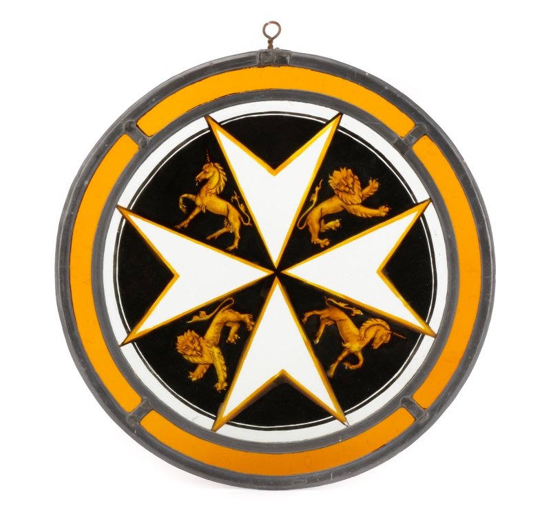 19th C. British Stained Glass Panel, Maltese Star: British, 19th century. A stained glass roundel depicting the badge of the Masonic Knights of Malta comprising a four point star at center with alternating lion and unicorn figural representations betw