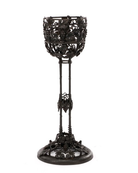 After Brandt Iron Jardiniere Stand, Marked: After Edgar William Brandt (French, 1880-1960). Black patinated wrought and cast iron metal jardiniere or plant stand with all over vineyard motif with interlacing grape vines with leaves and fruit cl