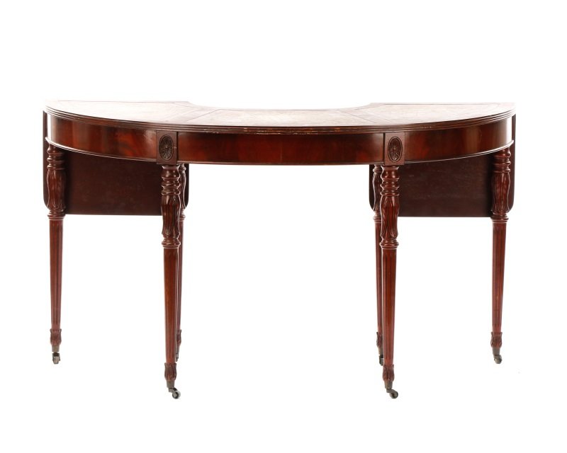 Sheraton Style Demilune Hunt or Wine Tasting Table: American, early 20th century. A Sheraton style mahogany demilune shaped hunt or wine tasting table, the top having a five section inset gilt tooled green leather surface over the conforming reeded edg