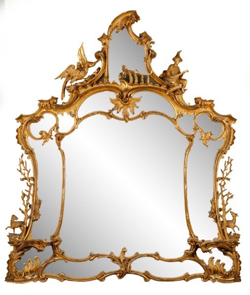 Extraordinary George III Giltwood Girandole Mirror: Circle of Thomas Johnson (British, 1714–1778) George III Rococo pierced giltwood girandole mirror, circa last half 18th century, of shield form with multiple shaped looking glass elements, centered