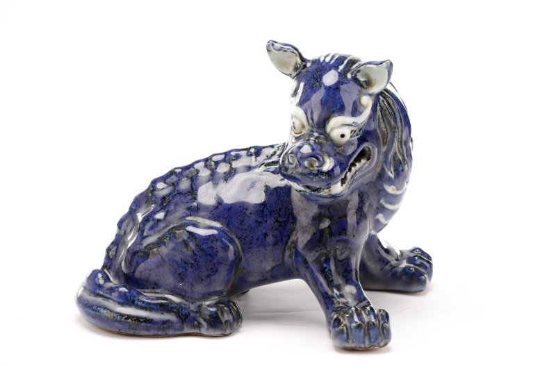 Chinese Cobalt Glazed Pottery Chimera, Xuande Mark: Chinese, Ming Dynasty Xuande Period mark (1426-1435), 20th century. A modeled pottery sculptural chimera depicted seated with front legs splayed and head turning to one side with bony spine detailed a