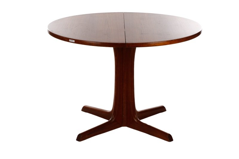 Niels Moller for Gudme Mobelfabrik Rosewood Table: Niels Moller (Denmark, 1922-1988) for Gudme Mobelfabrik, 1960s. A round Danish mid century modern teak dining table, having a round top with a banded edge on a four-fluted pedestal base. Marked "Gudme