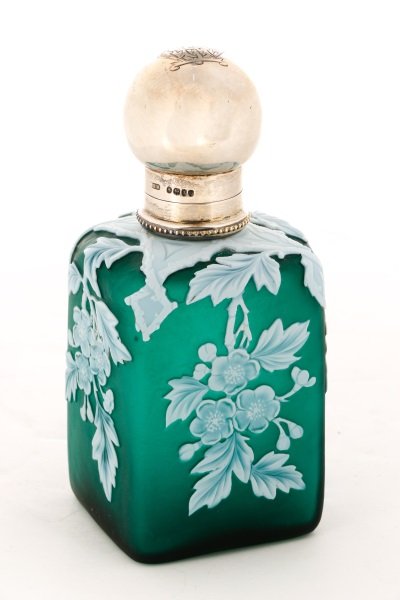 Webb Green Cameo Glass Sterling Lidded Perfume: Thomas Webb (English, 1804-1869), fourth quarter 19th century. A white cut back to satin finish forest green floral decorated perfume scent bottle having a sterling silver knob shaped threaded cover m