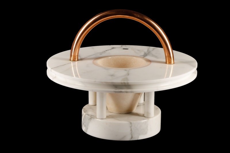 Ettore Sottsass 'Gaya' Marble Fruitbowl Sculpture: Designed by Ettore Sottsass (Italian, 1817-2007) for Up&Up (Italian, founded in 1969), circa 1983. A Memphis style "Gaya" marble fruitbowl sculpture having a copper tubular bent handle mounted to the 