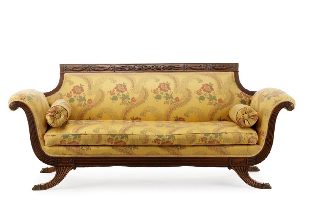 Classical Carved Sofa, Manner of Duncan Phyfe: Manner of Duncan Phyfe (American, 1768-1854), 19th century. Classical carved oak sofa having a scrolled top rail decorated with three rectangular carved panels, the central panel with ribbon tied whea