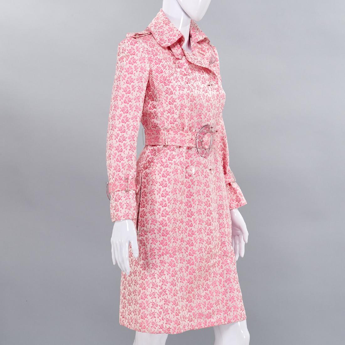 Tuleh pink floral silk brocade coat: Tuleh pink floral silk brocade coat, Early 2000's, silk blend, double breasted, shoulder epaulets, belted waist and sleeves, front zip pockets, fully lined in silk, lucite hardware, 33"b, 26"w, 15.5"s