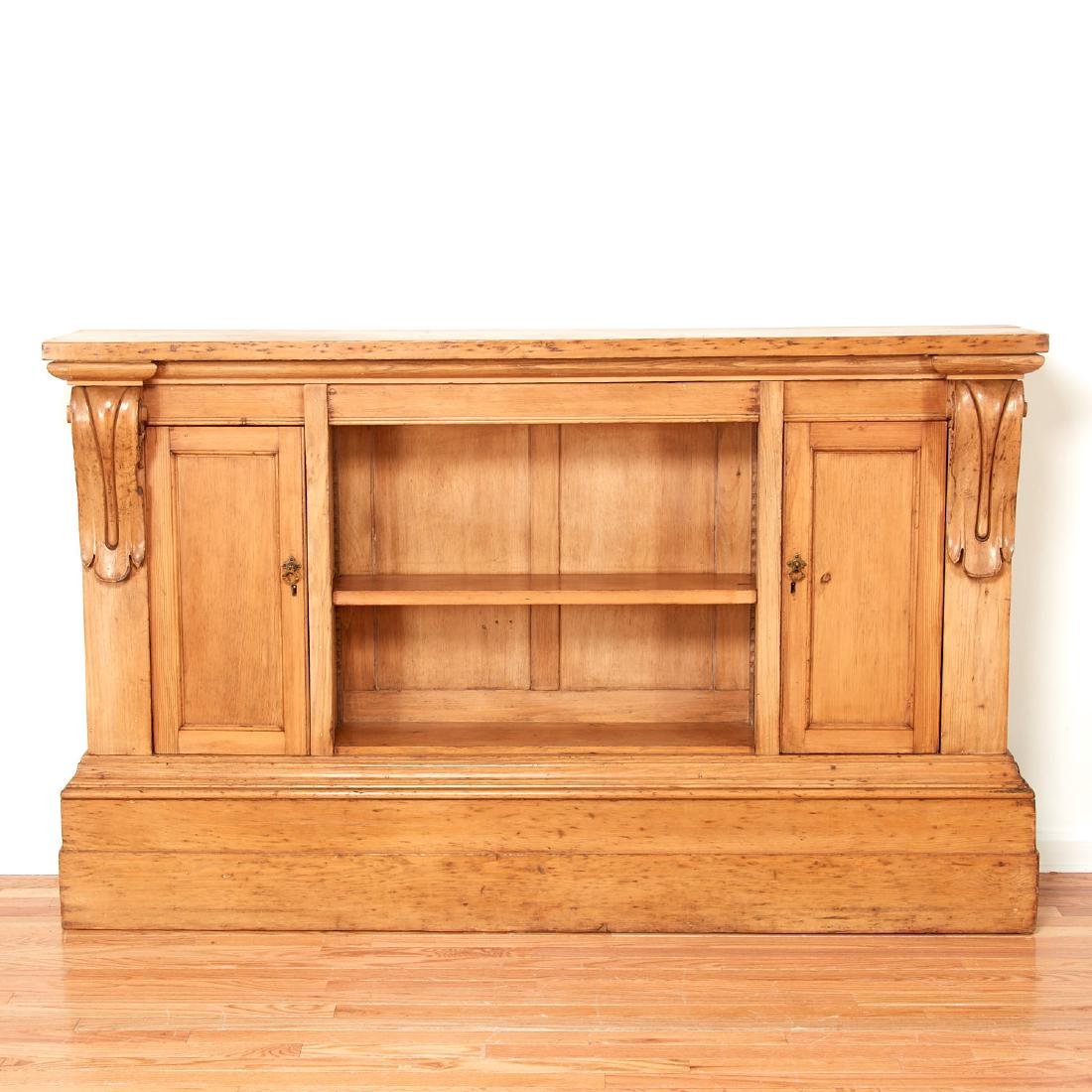 Georgian waxed pine sideboard: Georgian waxed pine sideboard, 19th c., England, open center shelf flanked by enclosed storage and volute brackets, 44"h x 72"w x 14"d