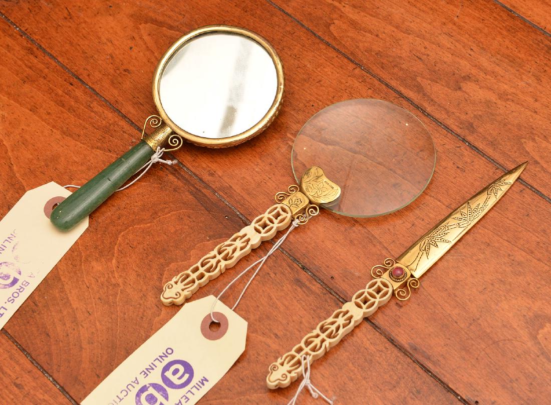 (3) Chinese desk and vanity articles: (3) Chinese desk and vanity articles, 19th/20th c., incl. jade handled hand mirror in brass frame with cabochon stones, unmarked, pierced bone handled letter opener and matching magnifying glass, mark