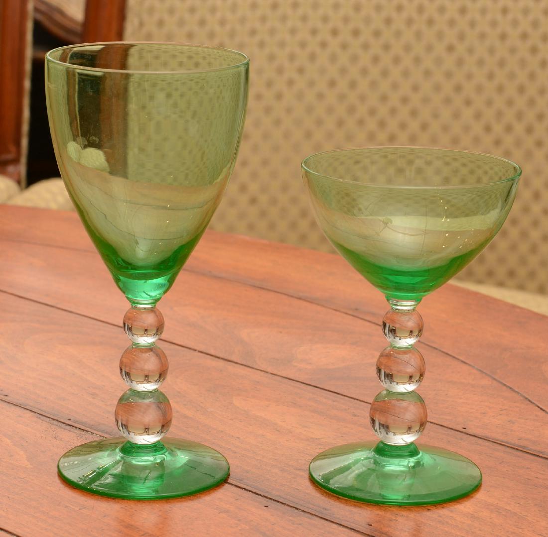 Art Deco green/colorless glass stemware set: Art Deco green/colorless glass stemware set, 20th c., clear glass stems, incl. (8) waters and (8) wines, unmarked, 7"h (waters), 5.25"h (wines) Provenance: Palmetto Hall: The Jay P. Altmayer Family Co