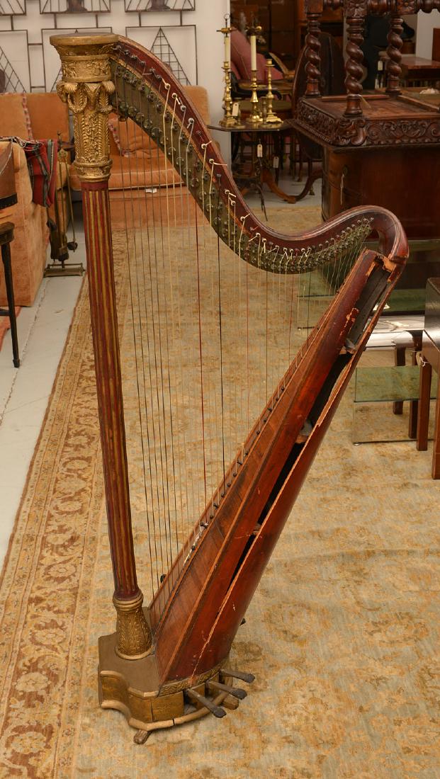 J. Erat parcel gilt Regency pedal harp: J. Erat parcel gilt Regency pedal harp, 19th c., London, gilt rams head, swag, and foliate decorated, engraved inscription reads "J. Erat, Maker, Wardour Street, Soho, London", 56.75"h x 26.25"w x 15"