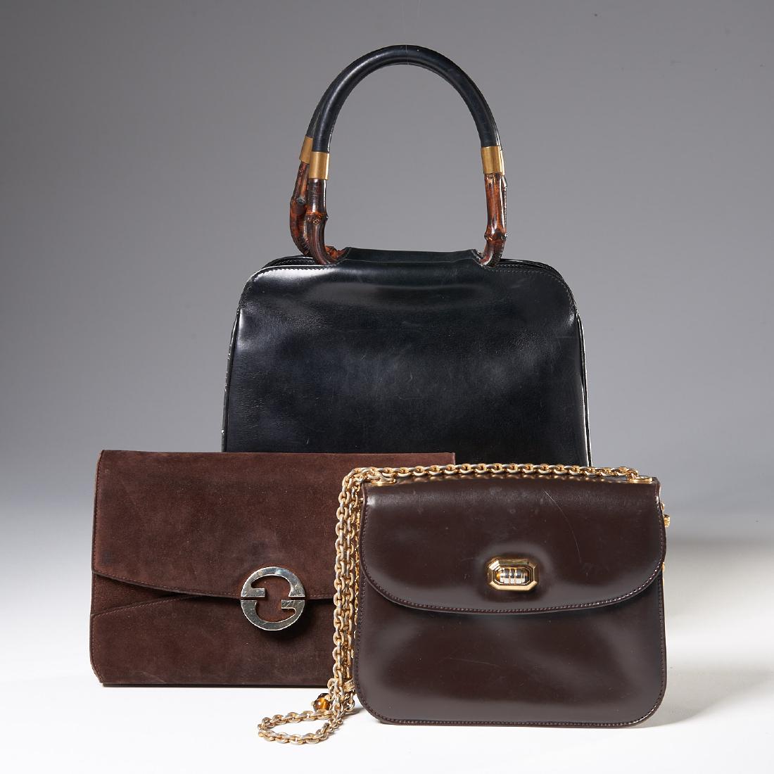 Group of Gucci handbags: Group of Gucci handbags, C. 1970's, (3) including: (1) brown suede with gold GG closure, 6.5"h x 10.5"w x 1.5"d, (1) brown lambskin with tiger's eye chain strap, gold hardware interior pockets, 7"h x 
