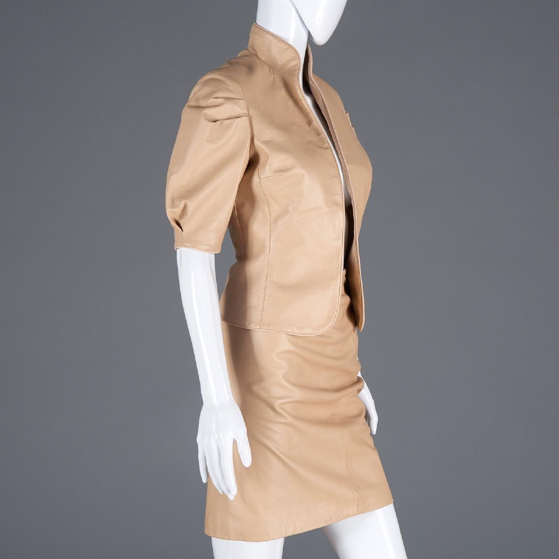 Richard Tyler Couture lambskin skirt suit: Richard Tyler Couture lambskin skirt suit, Late 20th c, nude lambskin leather skirt suit, half sleeves, silk lined, back zip skirt, skirt label marked sample, jacket 34"b, 25.5"w, 13.5"sh, 12.5"sl, 19