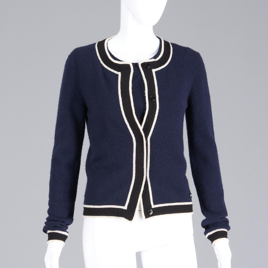 Chanel navy cashmere sweater twinset: Chanel navy cashmere sweater twinset, Cruise 2000, cardigan sweater with white piping trim, Chanel buttons, size 38, 34"b, 25"sl, 21"l, sleeveless tank, 34"b, 19"l Provenance: From a New York single o