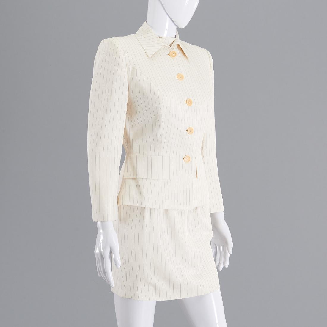 Richard Tyler silk pinstripe skirt suit: Richard Tyler silk pinstripe skirt suit, Late 20th c., cream, silk lined, (5) button, size (4), 33.5"b, 28"w, 15"sh, 21"sl, 21.5"l, skirt, back zippered, high waist, 26.5"w, 35.5"hip, 18.5"l Provenanc